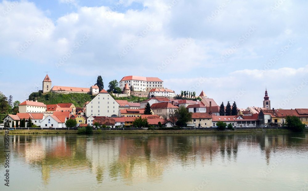 Beautiful panoramic view of city Ptuj Slovenia. Slovenia, old city Ptuj and river Drava, castle and church, panoramic view. Romantic old city of Ptuj, the oldest city in Slovenia.