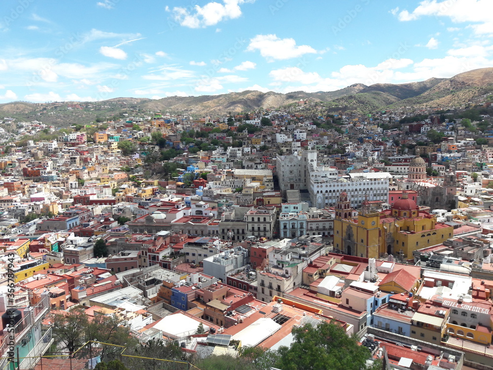 Guanajuato Mexico landscape and city churches and university with mountains 