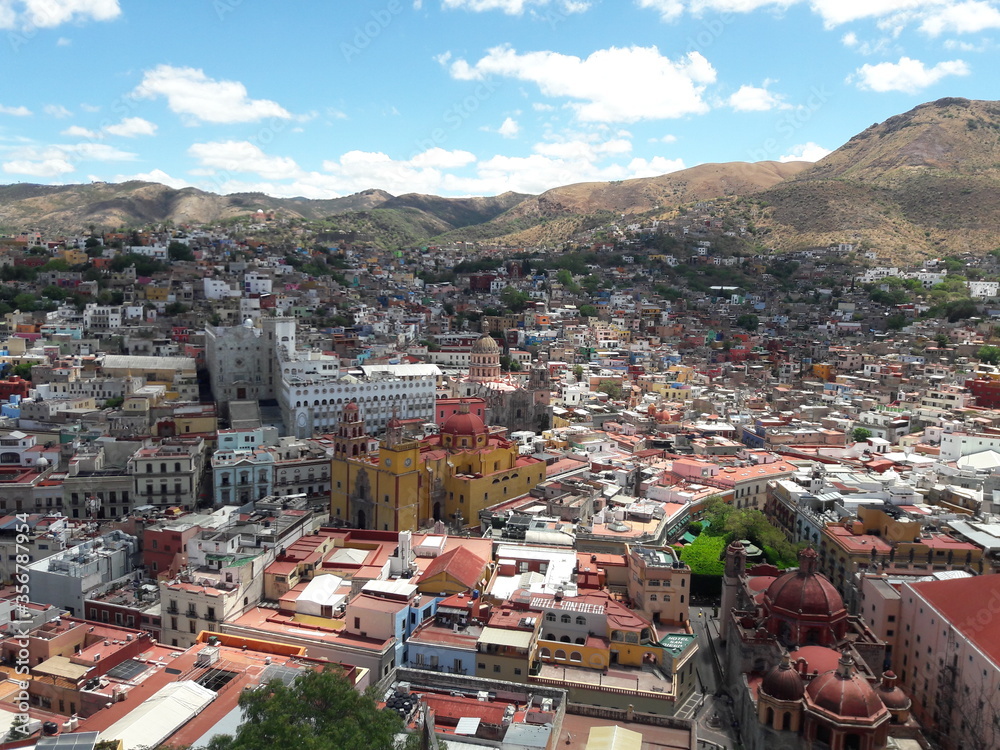 Guanajuato Mexico landscape and city churches and university with mountains 