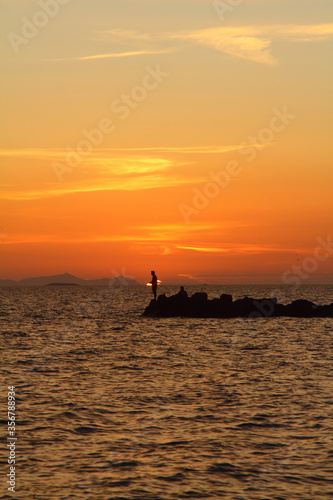 fishing in the sunset. Seaside town of Turgutreis and spectacular sunsets