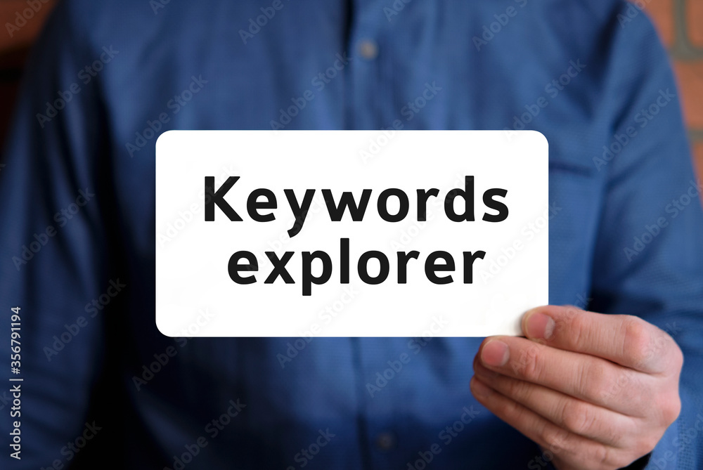 Keywords explorer - text on a white sign in the hand of a man in a blue shirt Keywords explorer - text on a white sign in the hand of a man in a blue shirt