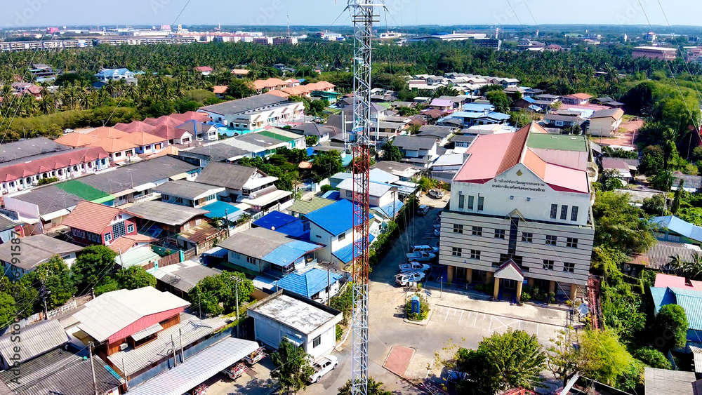 MAEKLONG, THAILAND - DECEMBER 15, 2019: Aerial view of Maeklong railway market and city skyline