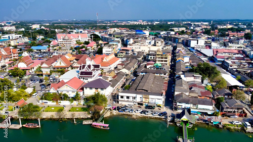 Aerial view of Maeklong railway market and city skyline, Thailand