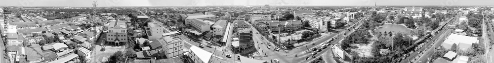 MAEKLONG, THAILAND - DECEMBER 15, 2019: Panoramic aerial view of famous railway market and city skyline