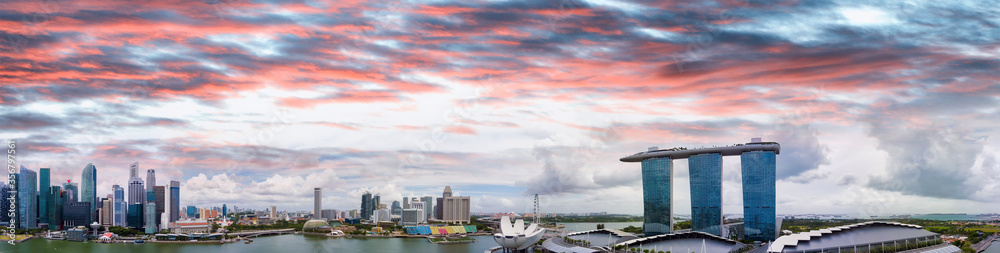Singapore skyline. Amazing aerial panoramic view of Marina Bay area at sunset