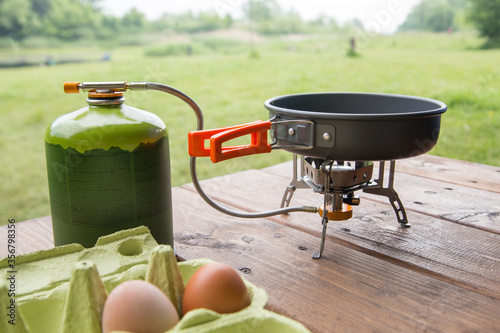 kitchen for camping with a gas burner, a gas cylinder on a frying pan