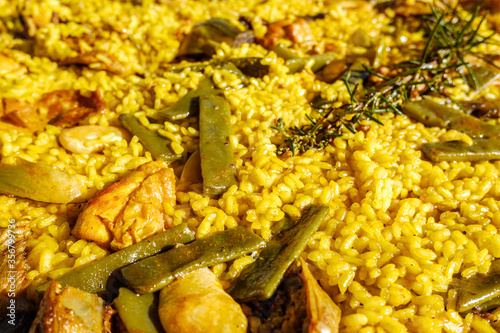 Detail of a yellow paella, Mediterranean rice from the gastronomy of Spain. photo