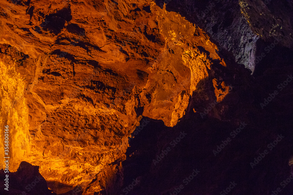 Cueva de los Verdes, Green Cave in Lanzarote. Canary Islands. an amazing lava tube and tourist attraction on Lanzarote island, Spain. Multi-colored illumination of caves. Beautiful cave. Cueva de los Verdes, Green Cave in Lanzarote. Canary Islands. an amazing lava tube and tourist attraction on Lanzarote island, Spain. Multi-colored illumination of caves. Beautiful cave.