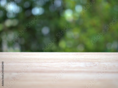 Empty wood table top on blur flowers garden background ,nature abstract blurred, display product, balnk table