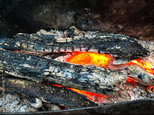 Smoldering firewood in the barbecue. Burning coal