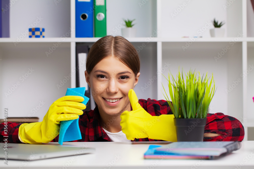 An employee of the cleaning company fulfills orders for office cleaning An employee of the cleaning company fulfills orders for office cleaning