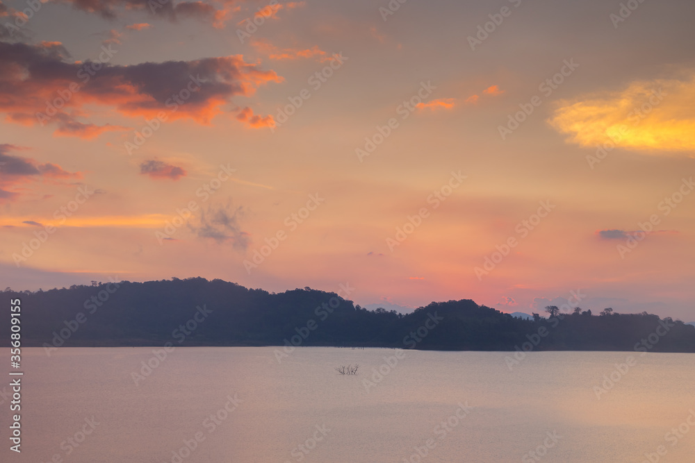 sunset over the lake and mountain 