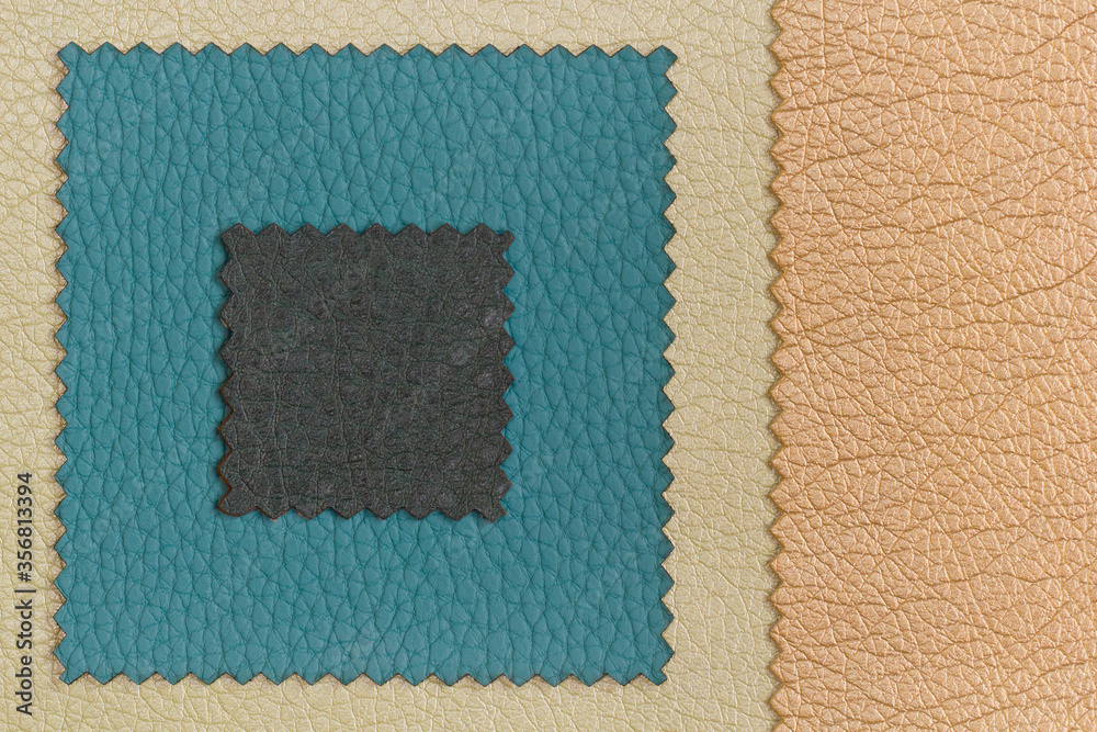 Fototapeta premium Background frame from samples of furniture leather crumpled structure of blue, brown and golden color in macro with copy space. Frame from factory furniture leather with a place for text.