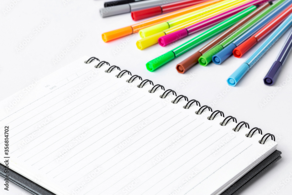 Notebook and Color pen on white background Notebook and Color pen on white background