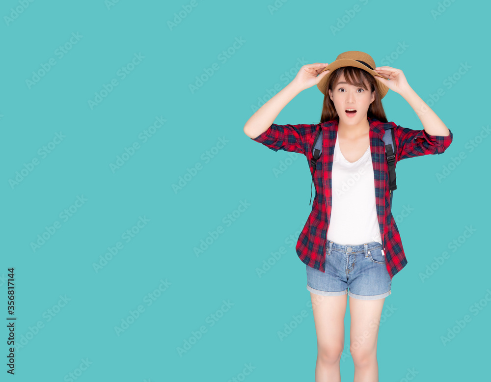 Beautiful portrait young asian woman smiling and surprise wearing travel summer fashion tourist in vacation isolated on blue background, girl shocked expression and emotion, holiday concept. Beautiful portrait young asian woman smiling and surprise wearing travel summer fashion tourist in vacation isolated on blue background, girl shocked expression and emotion, holiday concept.