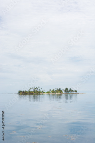 Paradise white sand island isolated in the caribbean sea in Guna Yala San Blas Panama, Horizontal Wide Shot Panorama © German