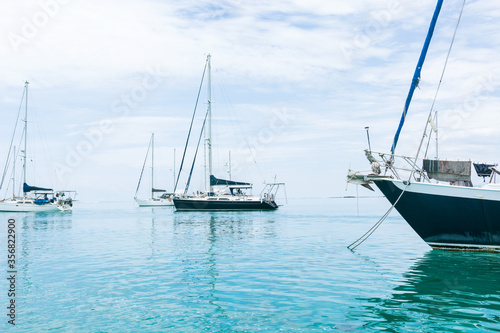 Beautiful seascape of blue sea with floating yacht and white cloud sky. luxury summer day lifestyle vacation tourism travel in Guna Yala, San Blas Islands, Panama, Central America - Horizontal wide