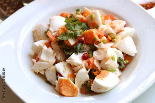 Closeup Salted egg salad and seasoning, chili powder, sugar, fish sauce, lemon