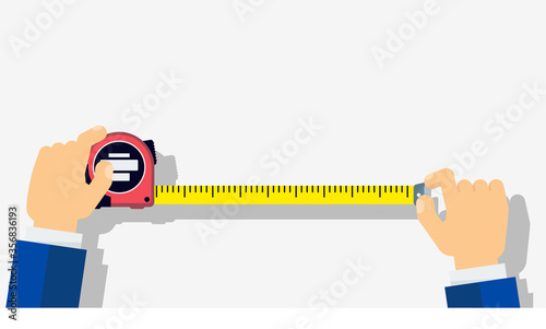 Measuring tape in the hands of a man. photo