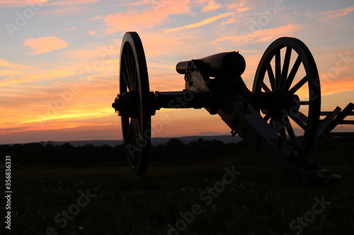 cannon with sunset in gettysburg photo
