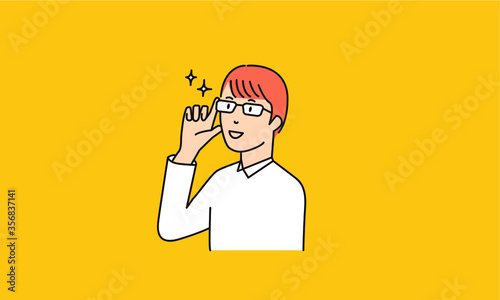 眼鏡をなおす男子学生