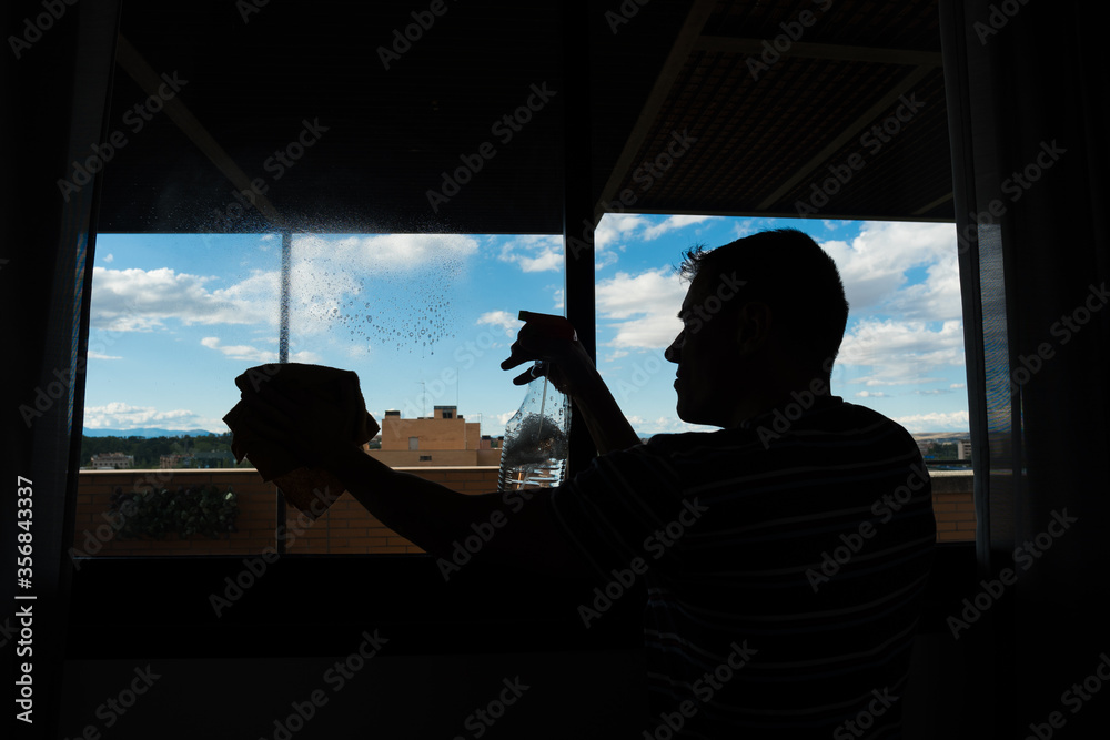 Man cleaning the windows. Man cleaning the windows.