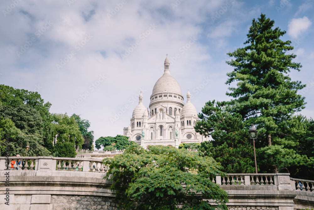 Beautiful hilltop view of the Basilica of the Sacred Heart of Paris Sacré-Cœur in Paris, France