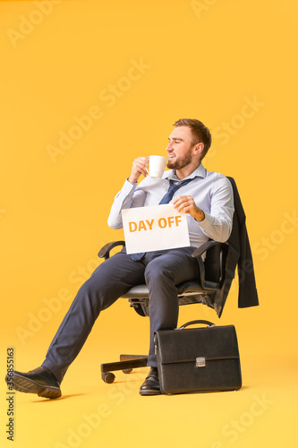 Young businessman with coff...