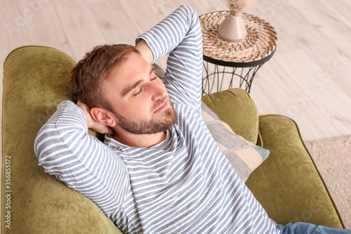 Lazy man spending day off a...