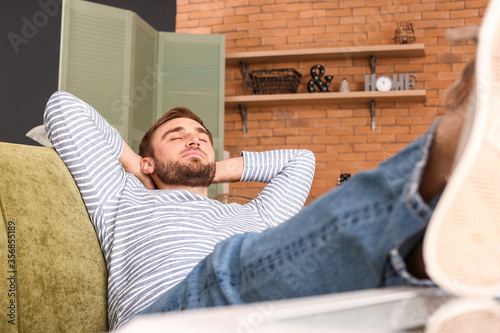 Lazy man spending day off a...