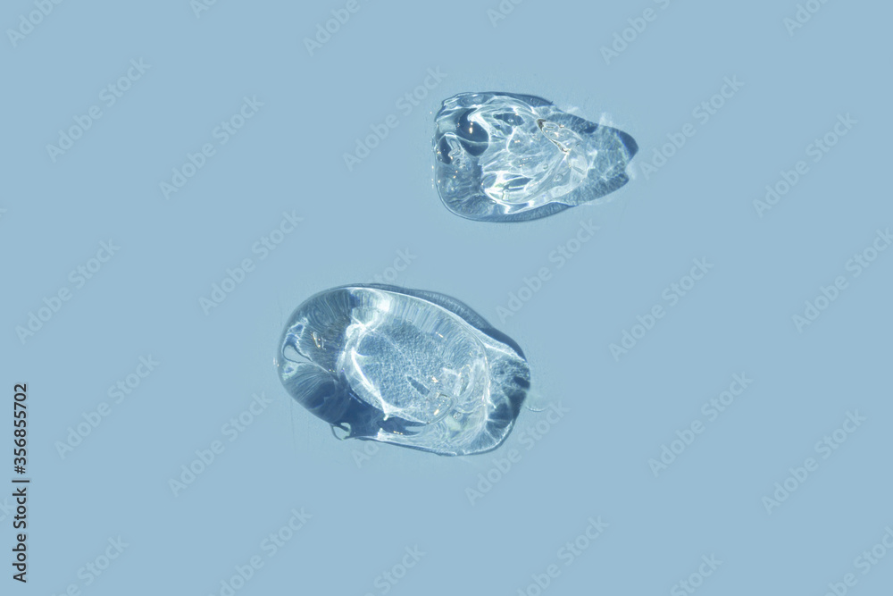 swathes of trasparent gel on blue background
