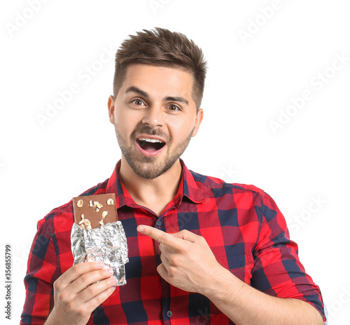 Handsome young man with tas...