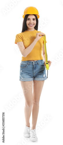 Young woman with measuring tape on white background