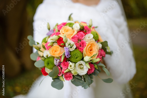 Wedding bouquet in hands of the bride