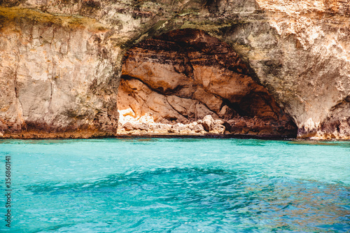 Panorama beach Blue Lagoon Comino Malta. Rocky coast with window and arch Mediterranean Sea