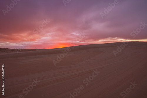 Colourful clouds over sand dunes at Myall Lakes National Park.East Coast of N.S.W. Australia.