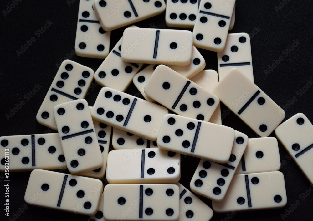 Closeup of a set of scattered domino pieces. Closeup of a set of scattered domino pieces.