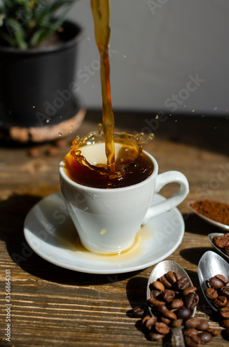 coffee splashes out of the cup