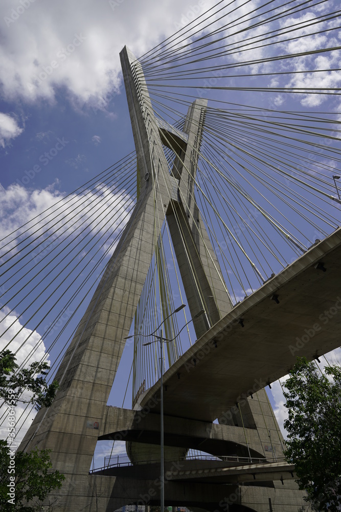 Fototapeta premium suspension bridge over blue sky