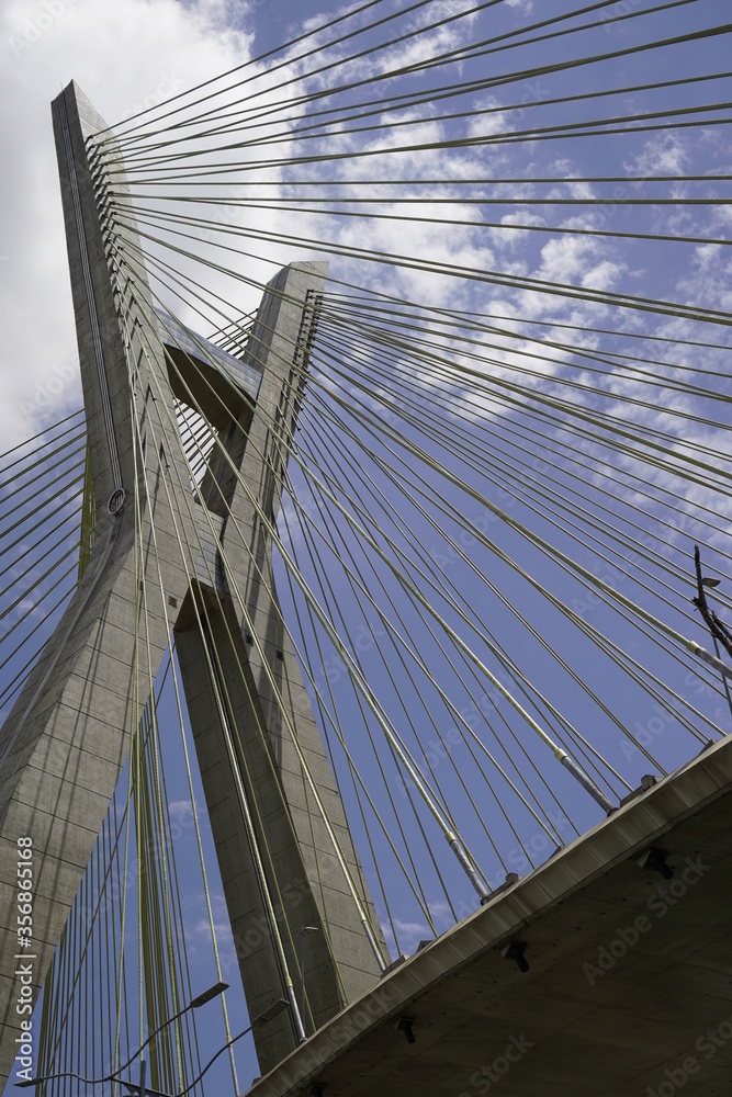 Obraz premium suspension bridge over blue sky