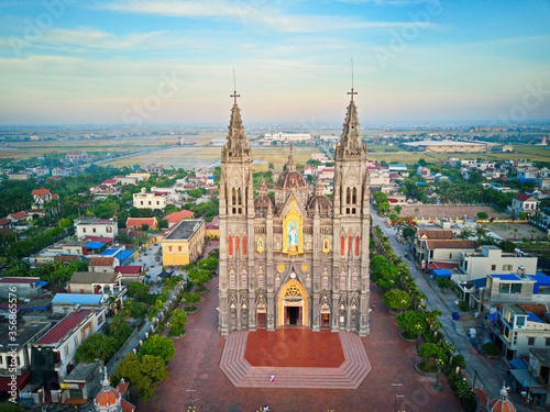 NAMDINH, VIETNAM - JUNE 7TH 2020: Hung Nghia Cathedral District at sunset. This is one of the most beautiful churches in Vietnam. photo