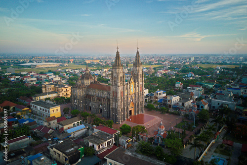 NAMDINH, VIETNAM - JUNE 7TH 2020: Hung Nghia Cathedral District at sunset. This is one of the most beautiful churches in Vietnam. photo