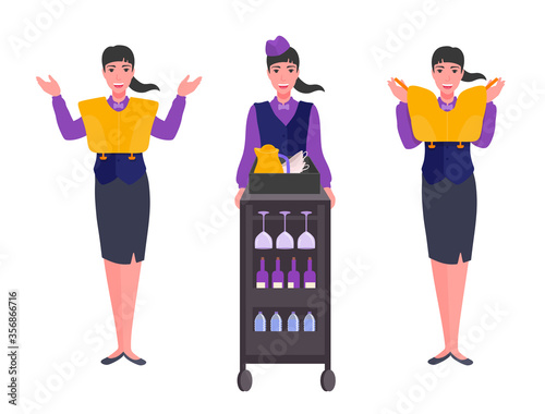 A flight attendant shows an inflatable life jacket, indicates the direction of emergency exits. An elegant stewardess. Airline safety demonstration. Trolley with drinks.