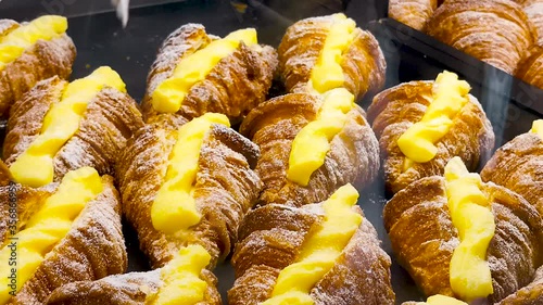 Japan fashionable dessert, fresh delicious sugar pudding mini croissant selling in bakery photo