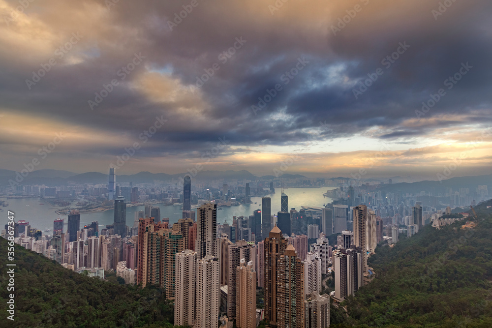 Fototapeta premium Aerial view of Victoria Bay at the top of Tianping Mountain at sunset in Hong Kong, China