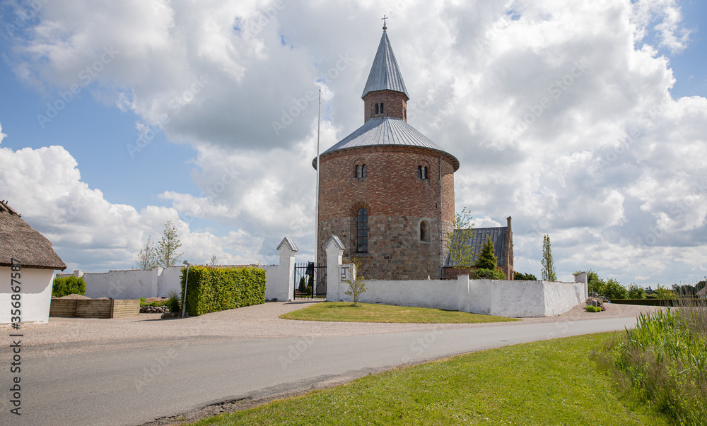 Old round church with blue sky and clouds 