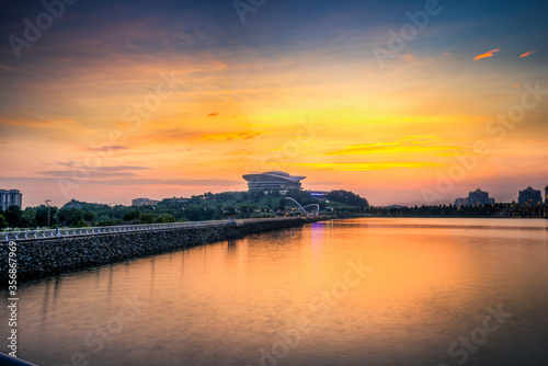Sunset view of the Putrajaya Convention Centre by the lake photo