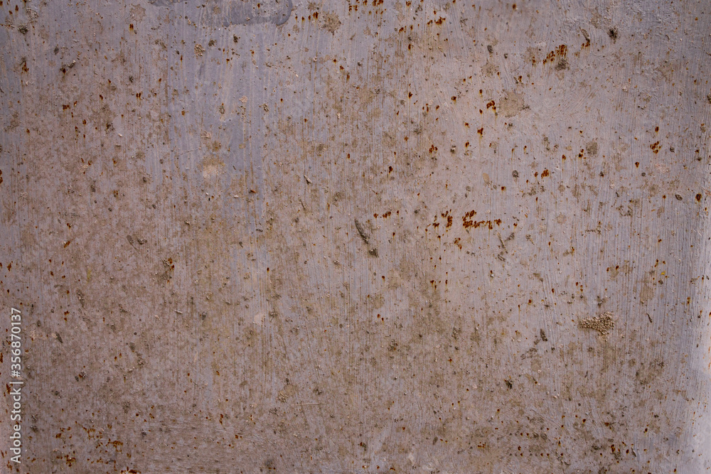 Rough Rusty painted metal surface on wall background with grey color, front or top view Rough Rusty painted metal surface on wall background with grey color, front or top view