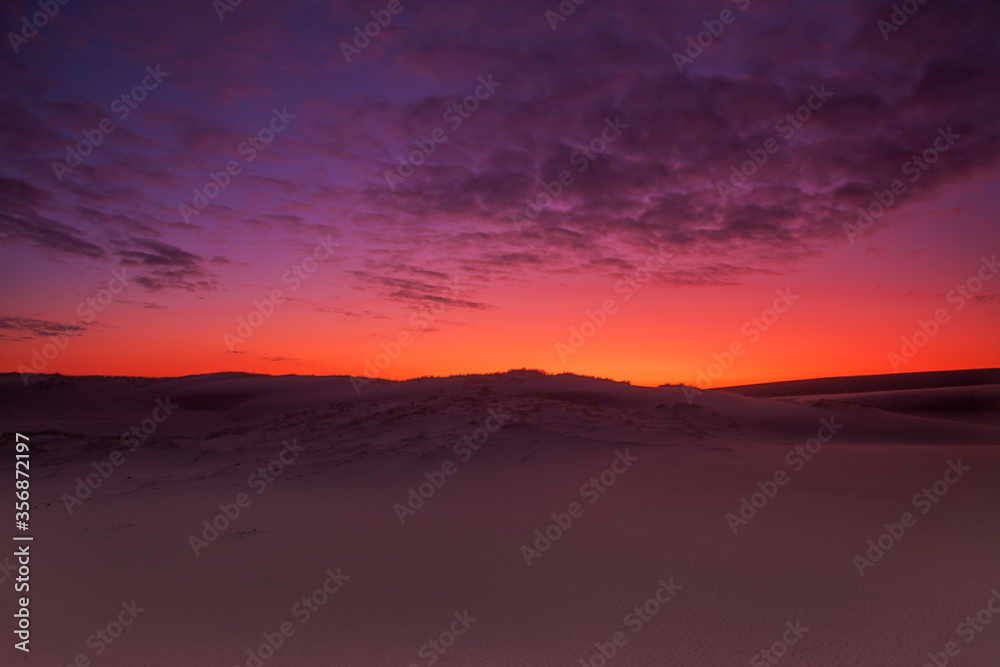 Colourful clouds over sand dunes at Myall Lakes National Park.East Coast of N.S.W. Australia. Colourful clouds over sand dunes at Myall Lakes National Park.East Coast of N.S.W. Australia.