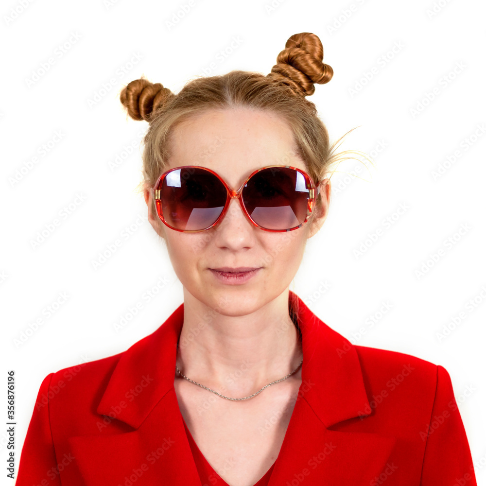 Funny, happy, young girl student, with an interesting hairstyle and sunglasses, looking at the camera, dressed in a red coat. Isolated on a white background. The concept of happy human emotions. Funny, happy, young girl student, with an interesting hairstyle and sunglasses, looking at the camera, dressed in a red coat. Isolated on a white background. The concept of happy human emotions.